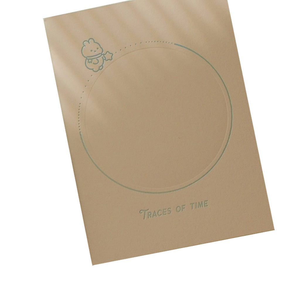 Notebook with circular design and 'Traces of Time' text on a white background