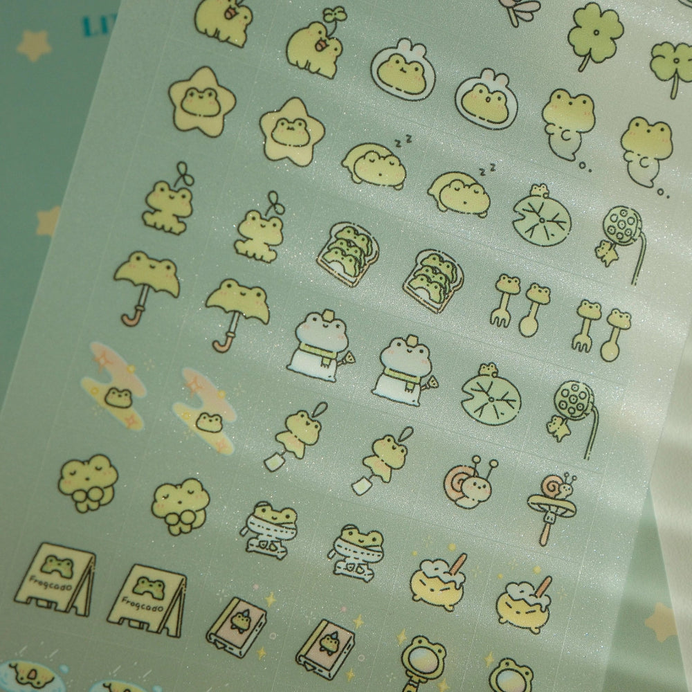 Sheet of green stickers with various cartoon frog designs on a green background.