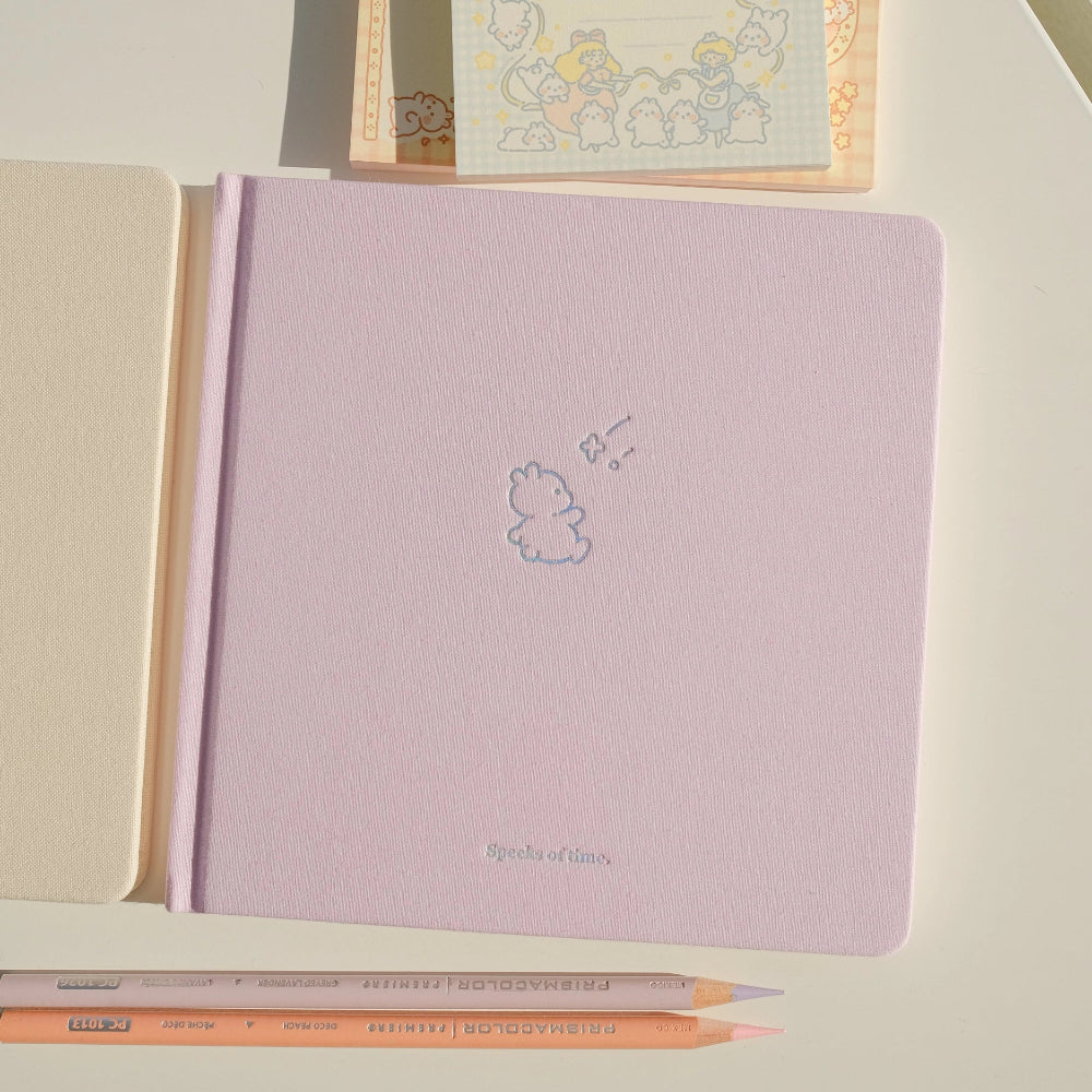 Violet notebook with a cute design and a pen on a light background