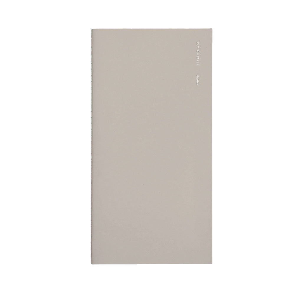 Beige notebook with foil writing on the top right corner