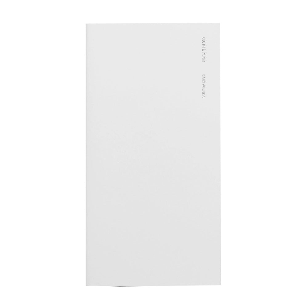 White notebook with foil lettering on the front