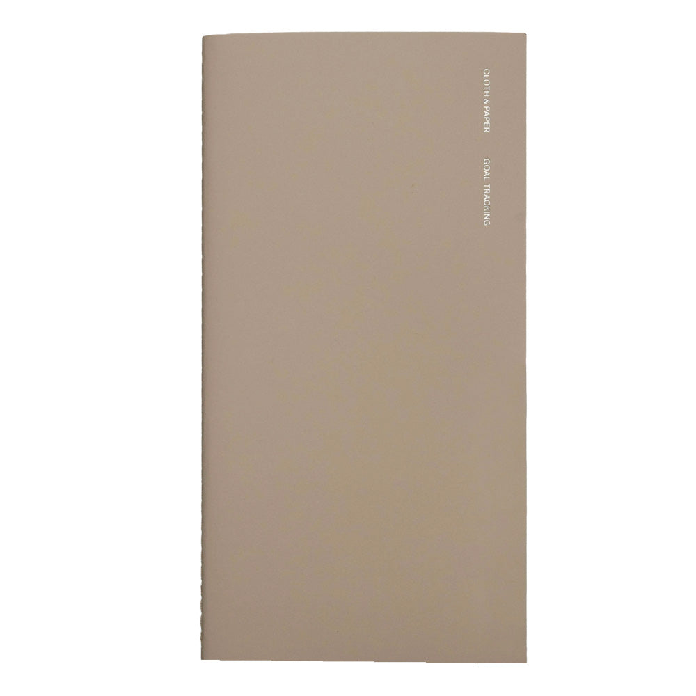 Beige notebook with foil lettering on front 