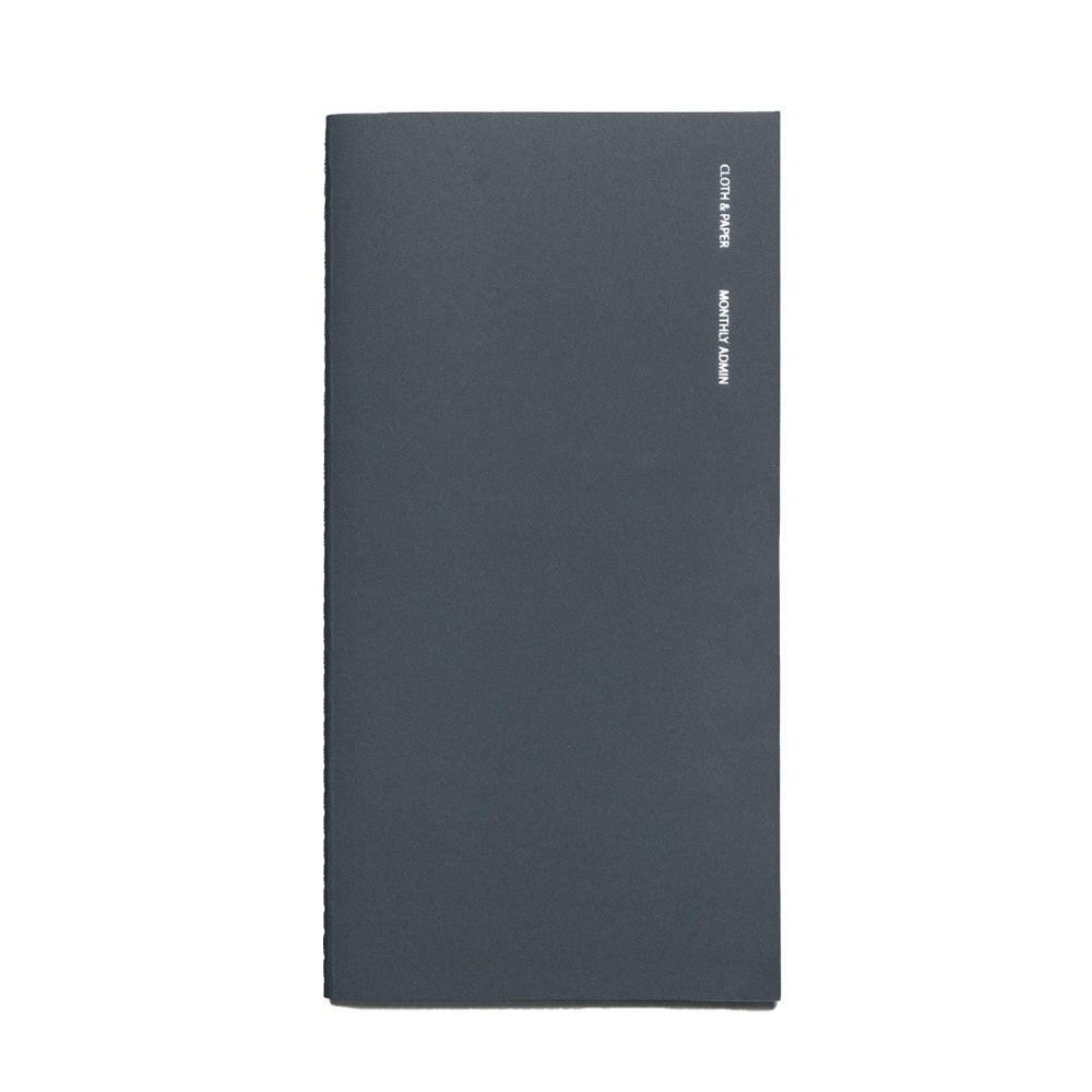 Blue notebook with foil lettering on the front