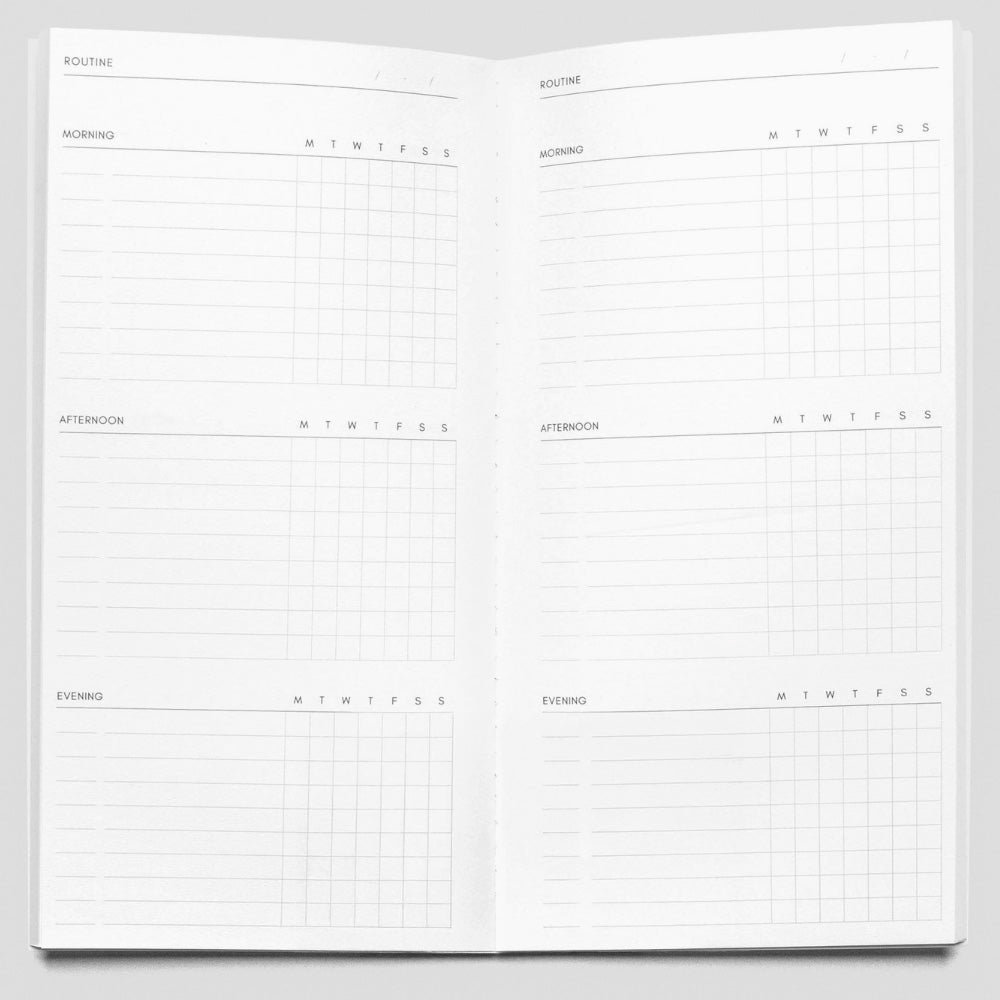 Open planner with daily schedule layout on a white background