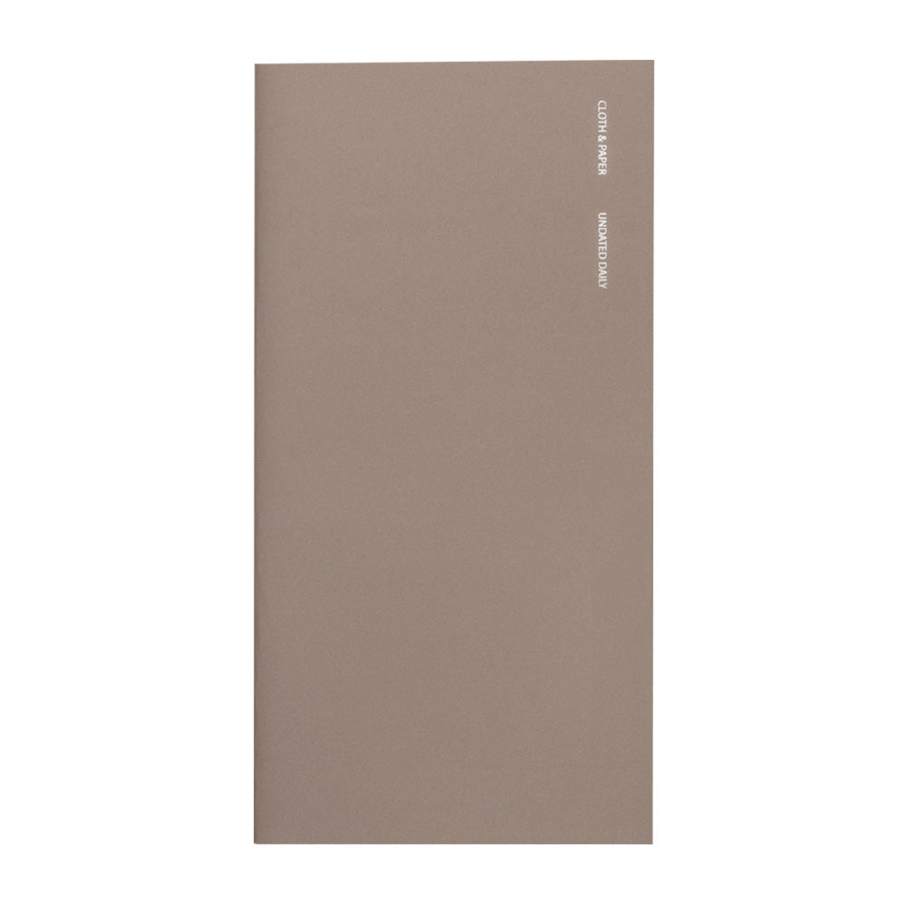 Brown notebook with foil lettering on the front