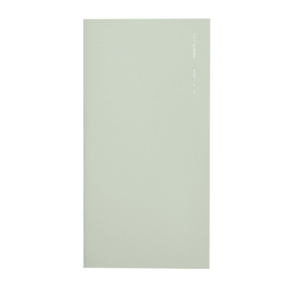 Green notebook with foil stitching on the front