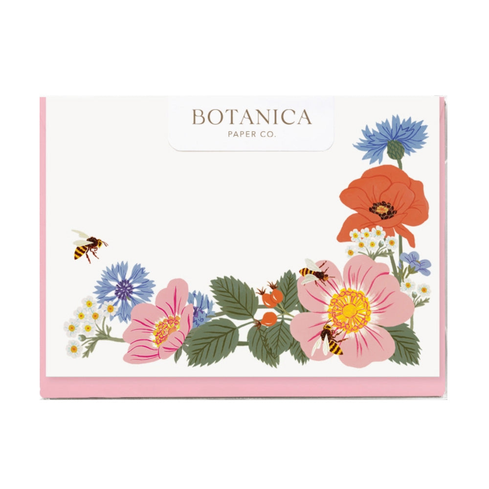 Boxed cards with a flower design in the bottom right and a white background.