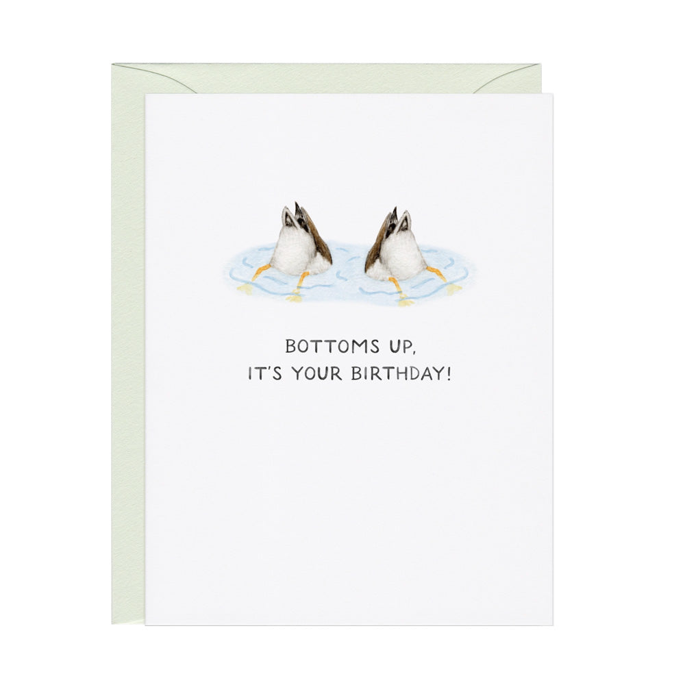 Birthday card with duck butts in the air in water and 'Bottoms up, it's your birthday!' text.