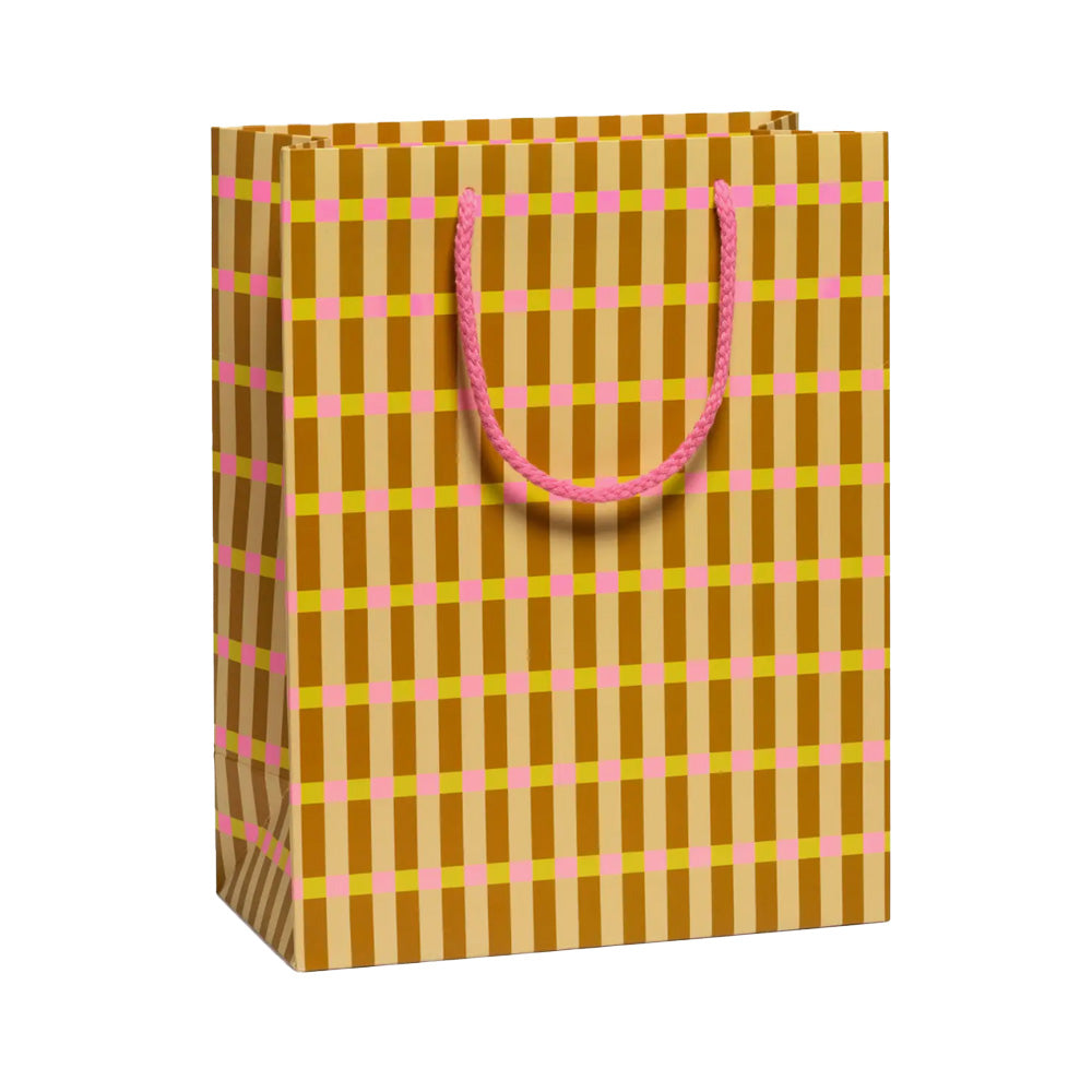 Gift bag with brown and pink checkered pattern on a white background