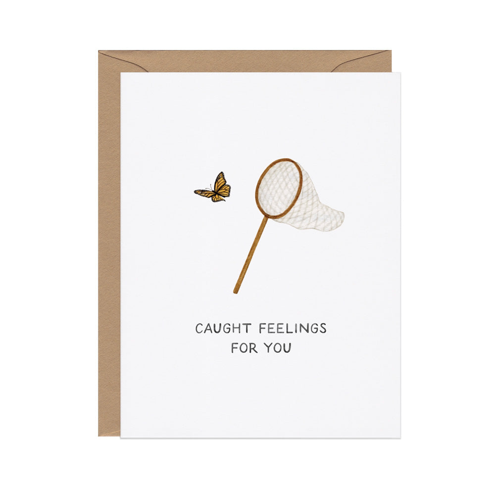 Greeting card with a butterfly and net illustration and text 'Caught Feelings for You' on a white background.