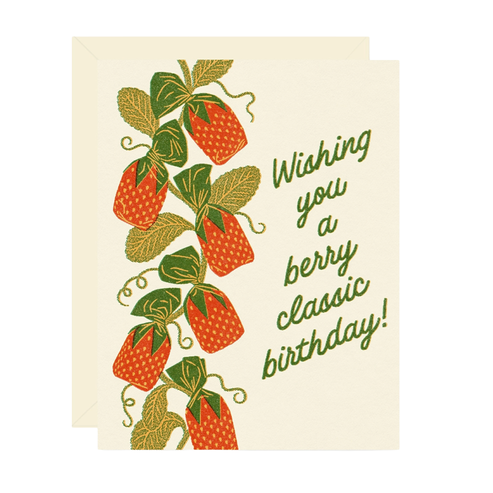 Birthday card with strawberry candies on a vine with leaves and text that reads "Wishing you a berry classic birthday"