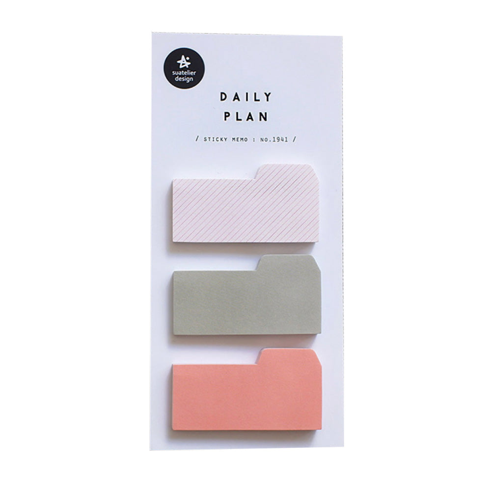 A pack of Daily Plan sticky memo notes in pink, green, and striped white colors, with a folder tab on each sticky note on a white background.