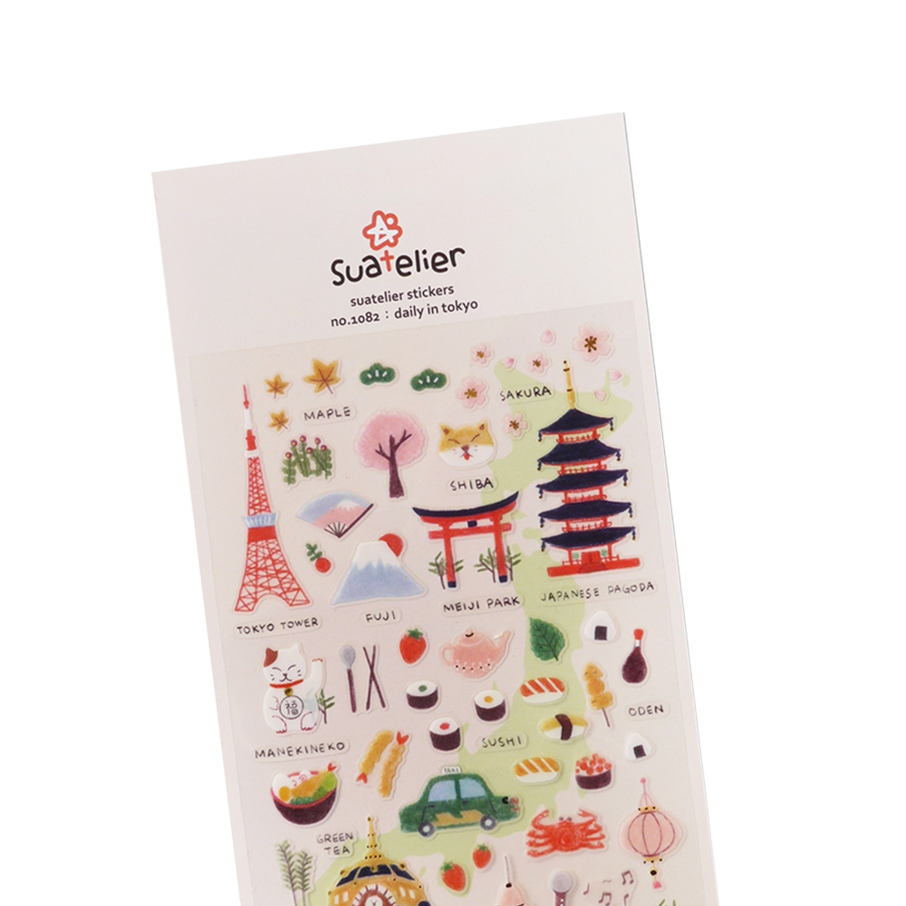 Sticker sheet with various designs from a day in Tokyo. Examples include Tokyo Tower, a Shiba, Maple leaves, Sakura flowers, Sushi, Green Tea, etc.