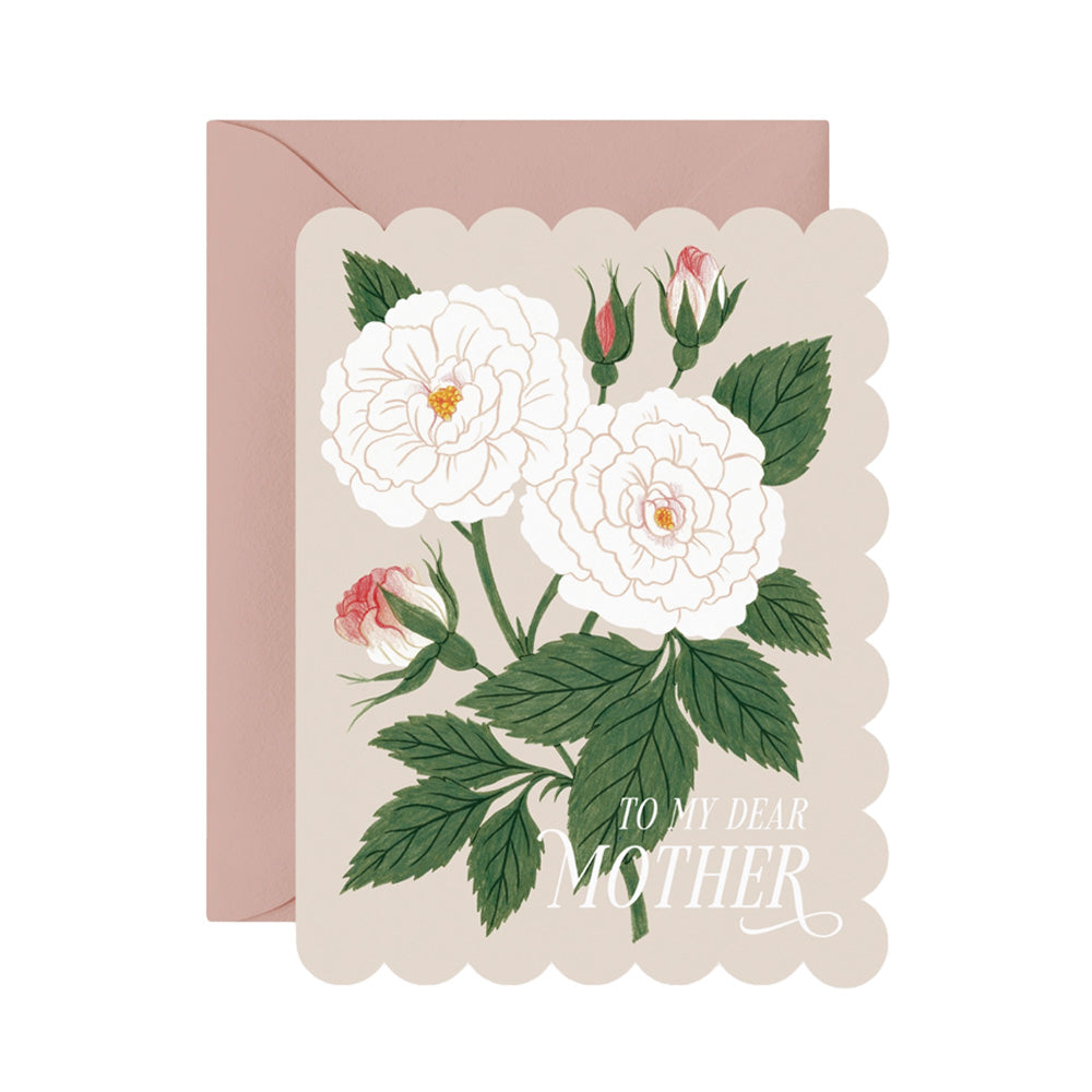 Two full white flowers next to each other on a scalloped edge cream card with the words "To My Dear Mother' in a script font.