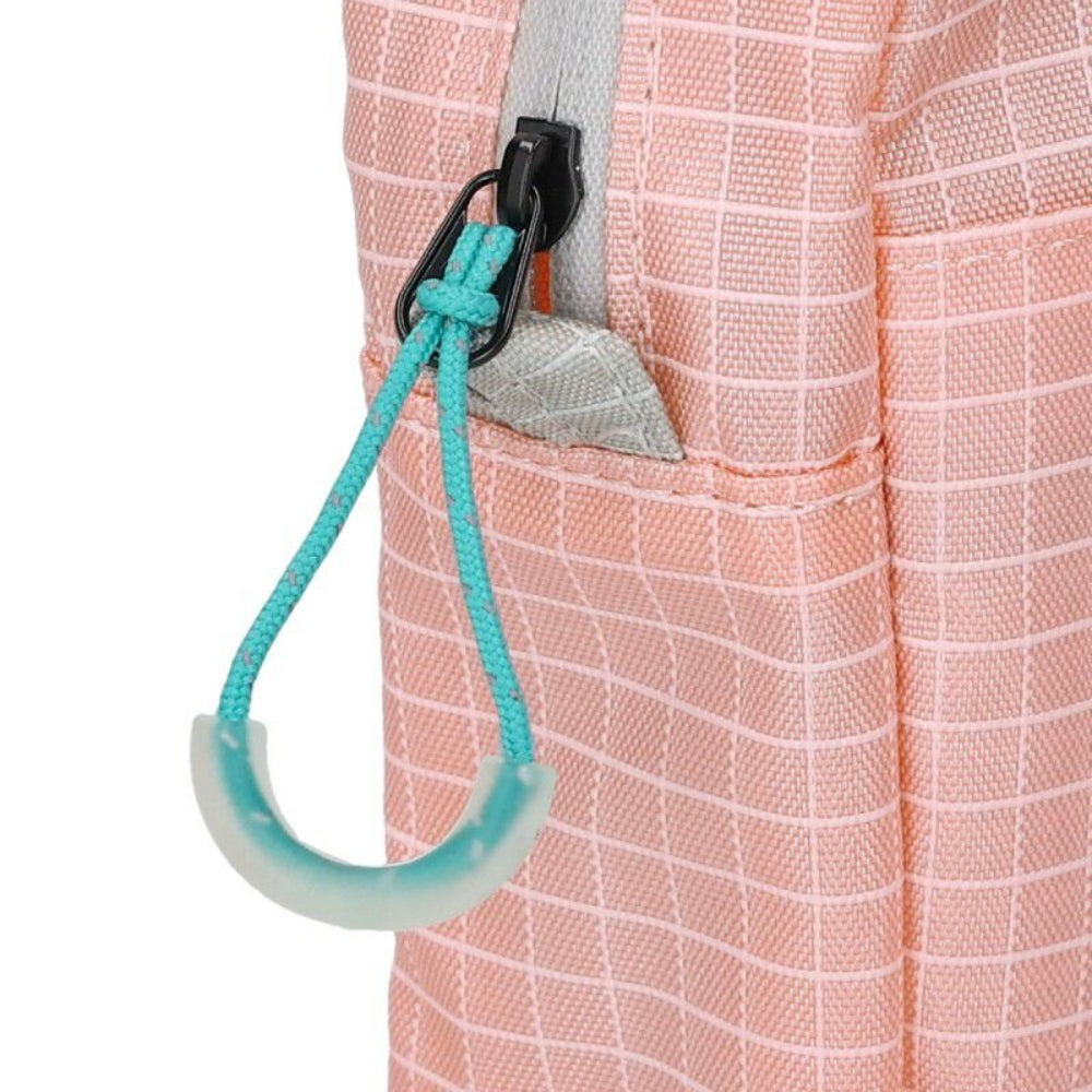 Close-up of a pink bag with a turquoise strap and hook on a white background