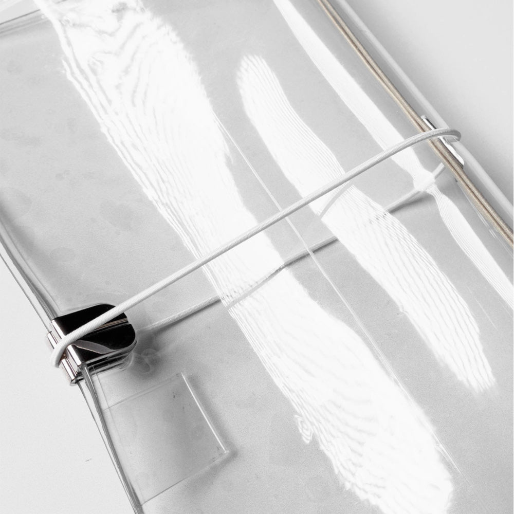 Clear notebook cover with white elastic band wrapped around it