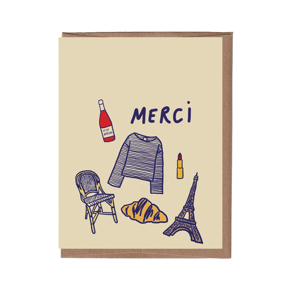 A beige greeting card with a brown kraft envelope, featuring a hand-drawn Paris-themed illustration with the word 'Merci' and icons for a bottle, sweater, lipstick, chair, croissant, and Eiffel Tower.