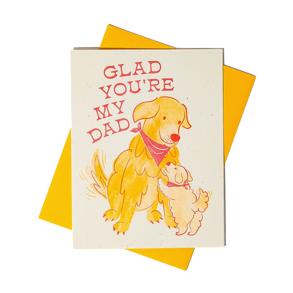 Greeting card with two dogs and 'Glad You're My Dad' text on a yellow envelope.