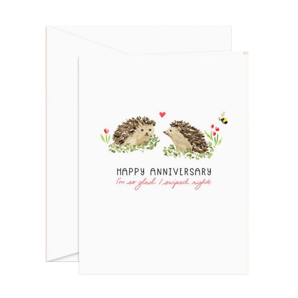 Greeting card with hedgehogs and "Happy Anniversary" text and "I'm so glad I swiped right" text on a white background