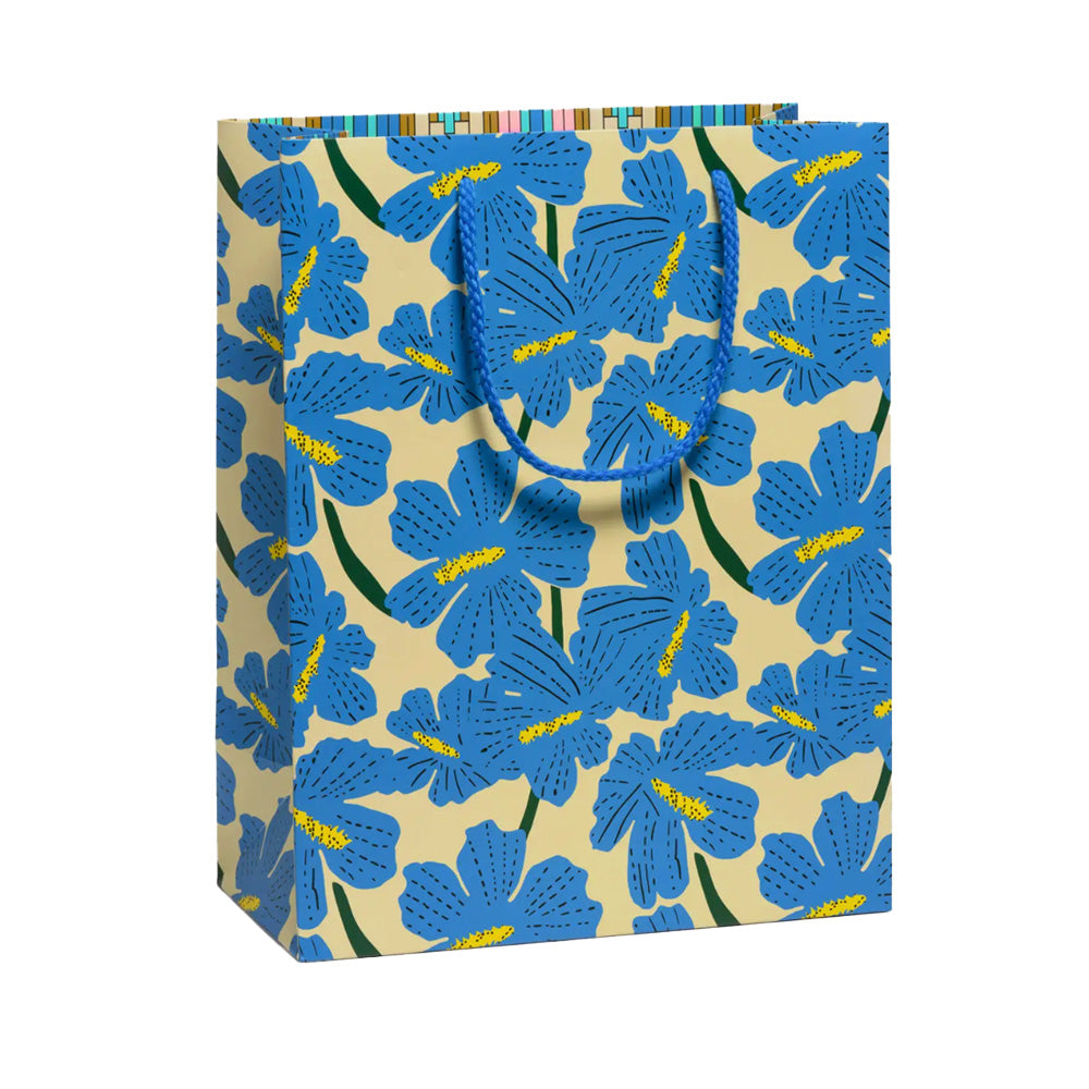 Gift bag with blue hibiscus pattern on a pale yellow background