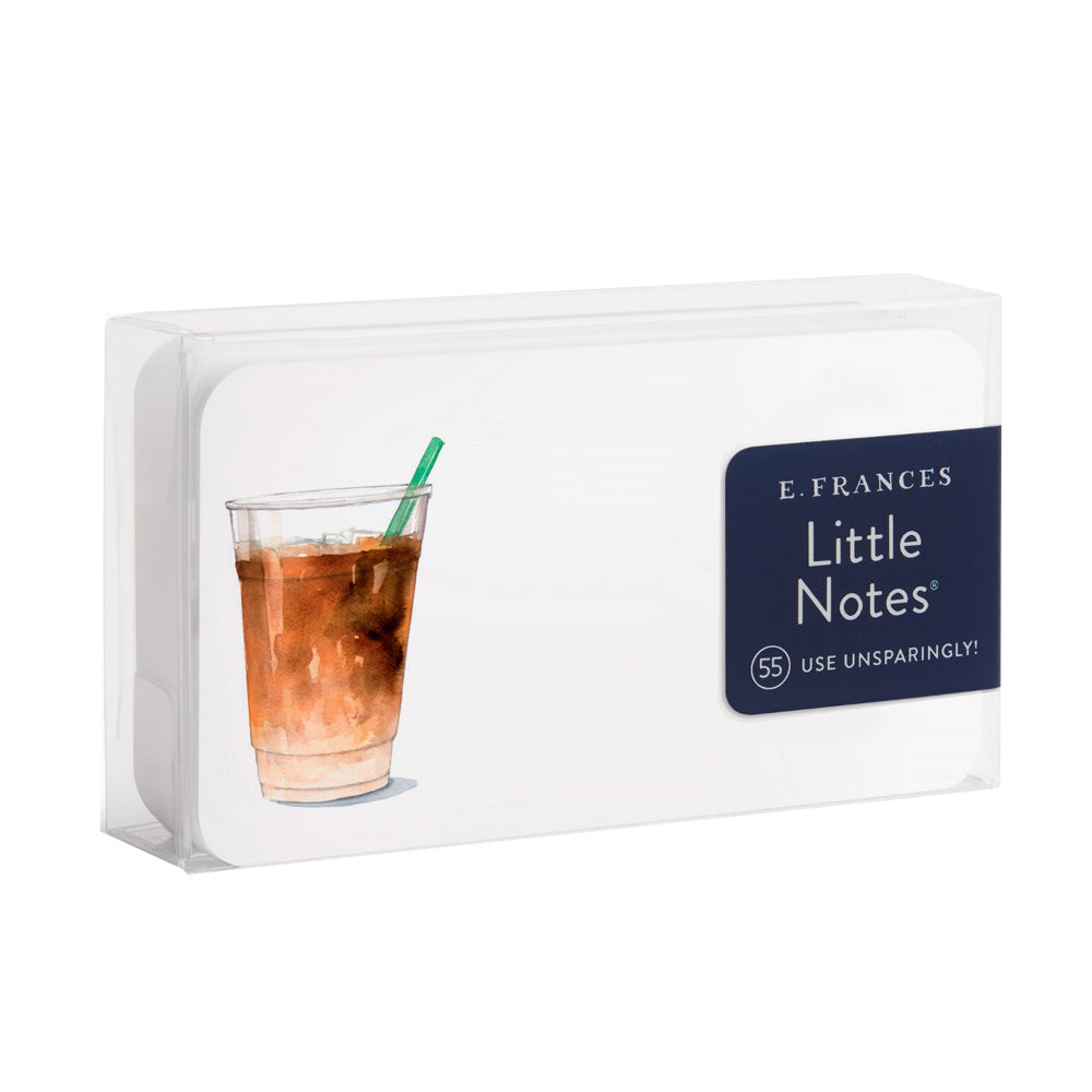 Pack of E. Frances Little Notes with a glass of iced coffee on a white background
