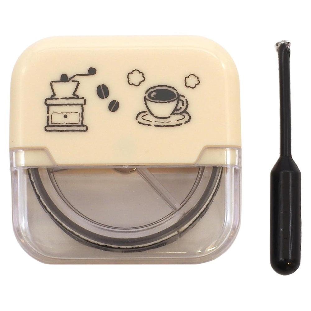 Cream-colored rubber stamp with coffee-themed design and black handle on a white background