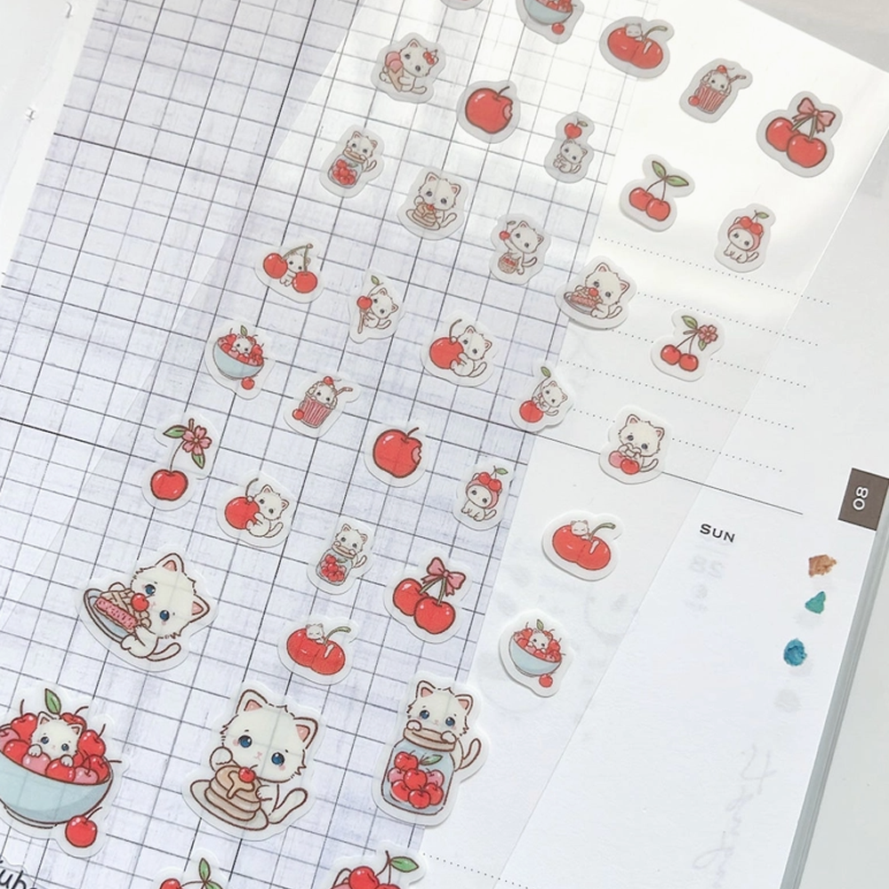 Clear sticker sheet of white kittens and cherries.