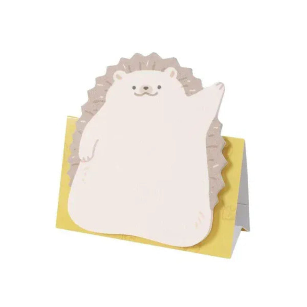 Hedgehog-shaped sticky note pad with a yellow base on a white background