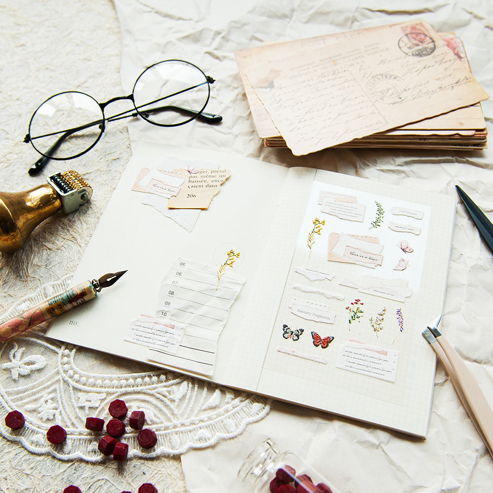 Open notebook with stationery items on a textured surface