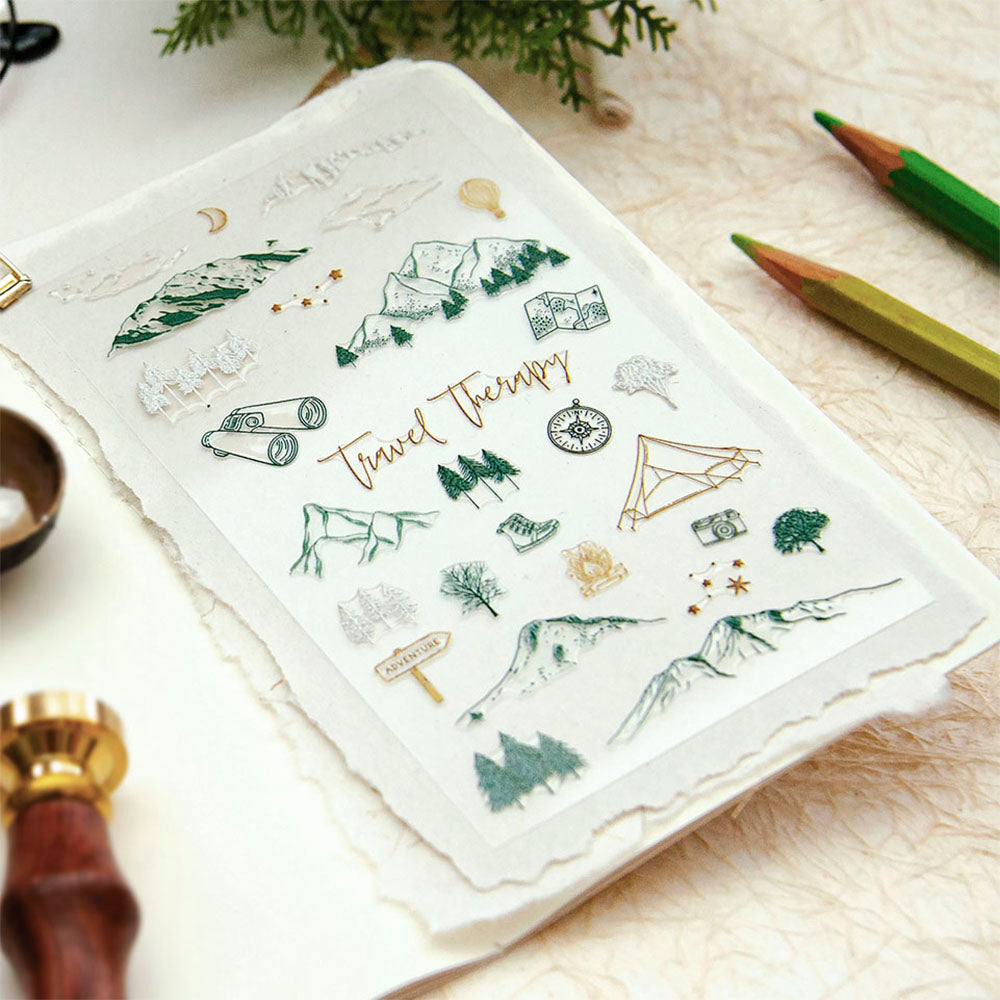 Sheet of travel-themed stickers with nature illustrations on a textured surface.