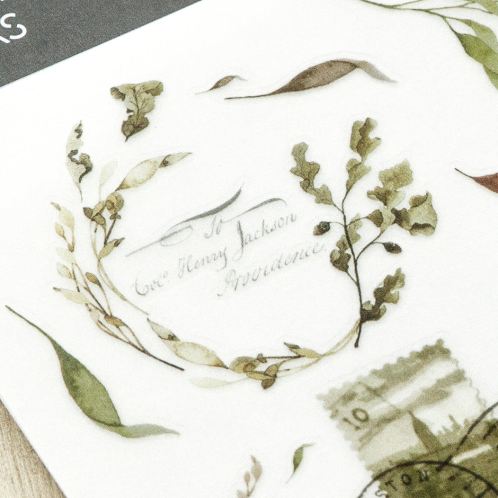 Sheet of plant cut-out stickers with green leaves and brown stems on a white background.