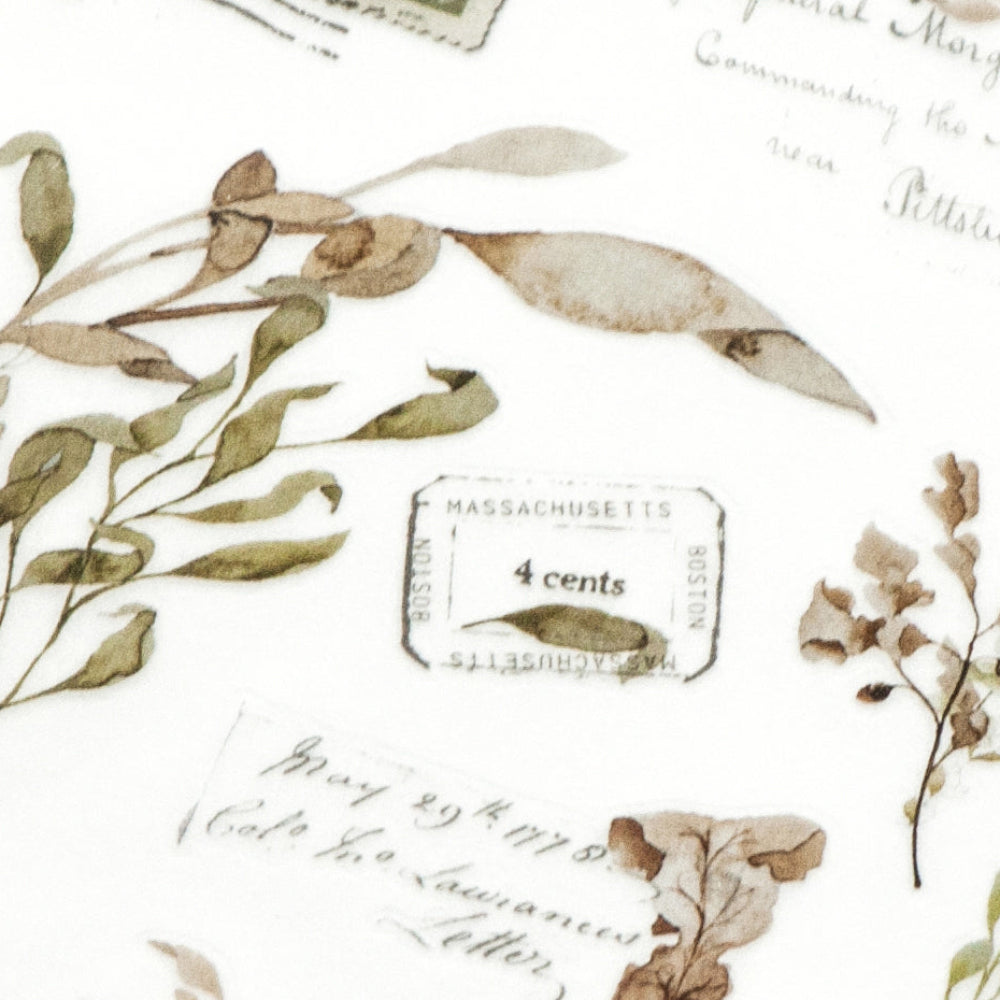 Decorative paper with floral elements and vintage stamps on a textured surface