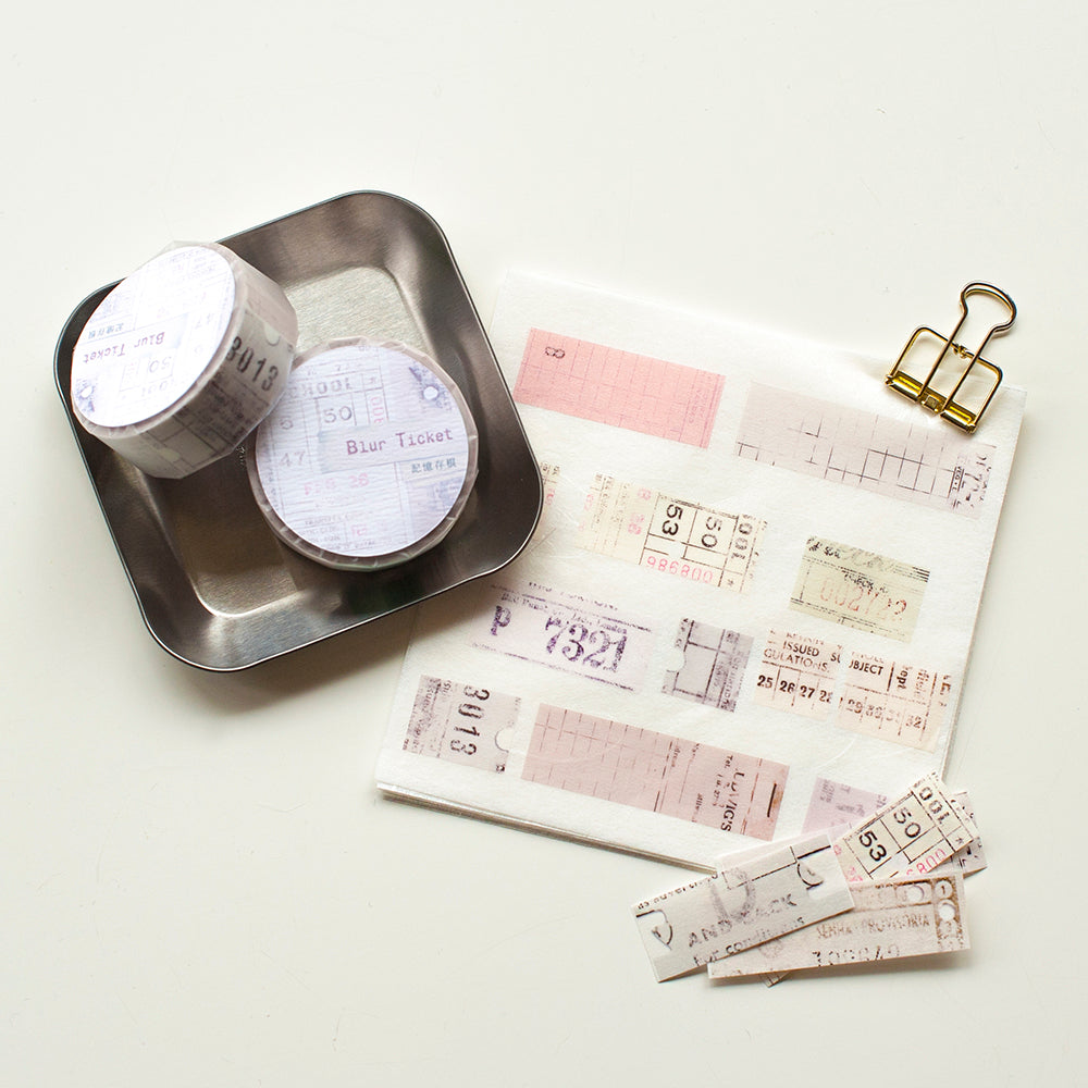 Two Washi Tapes in a tray with washi tape pieces in a ticket design on a white background