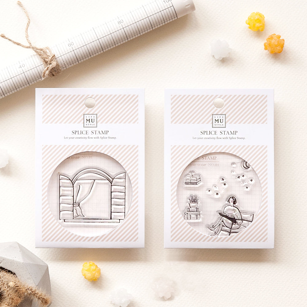 Two MU Spice Stamp packages on a light surface with decorative items.