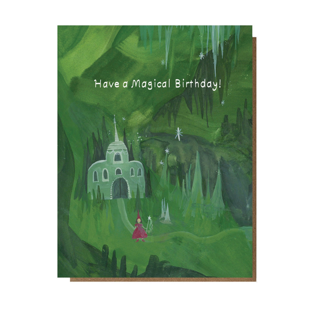 Greeting card with a fairy tale castle and fairy in a forest, text 'Have a Magical Birthday!'.