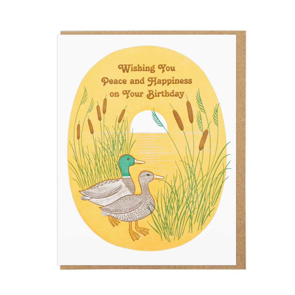 Greeting card with ducks and cattails on a yellow background, featuring text "Wishing you peace and happiness on your birthday"