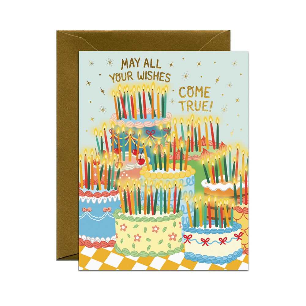 Greeting card with a colorful birthday cake illustration and text 'May all your wishes come true!' on a light blue background.