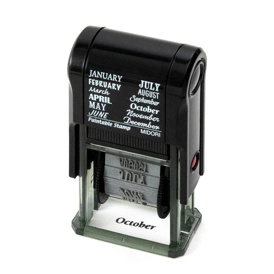 Black calendar stamp with ink pad on a white background