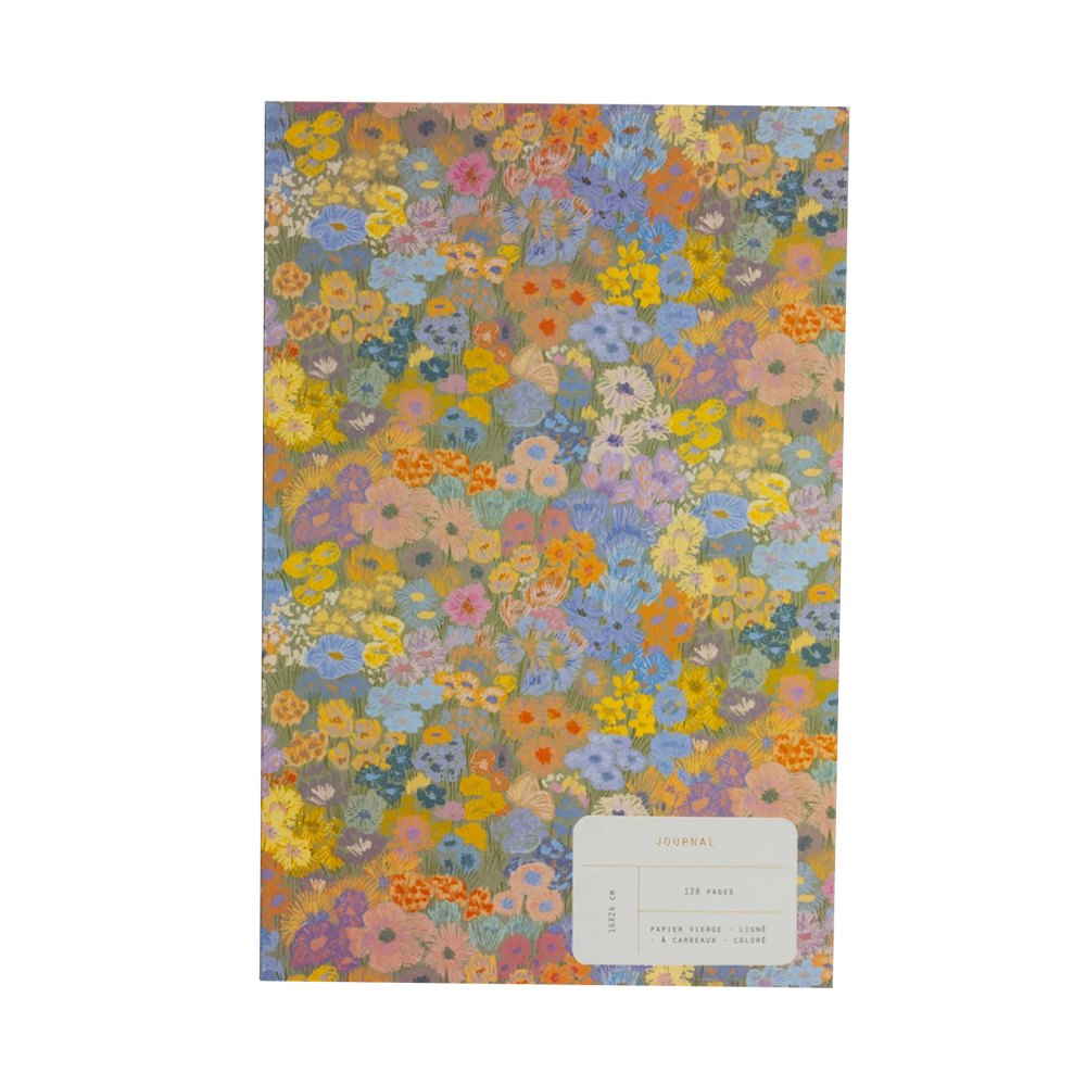 Journal with a field of wildflowers on the cover and a brand label.