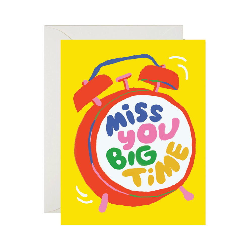 Greeting card with a colorful alarm clock design and 'Miss You Big Time' text on a yellow background.