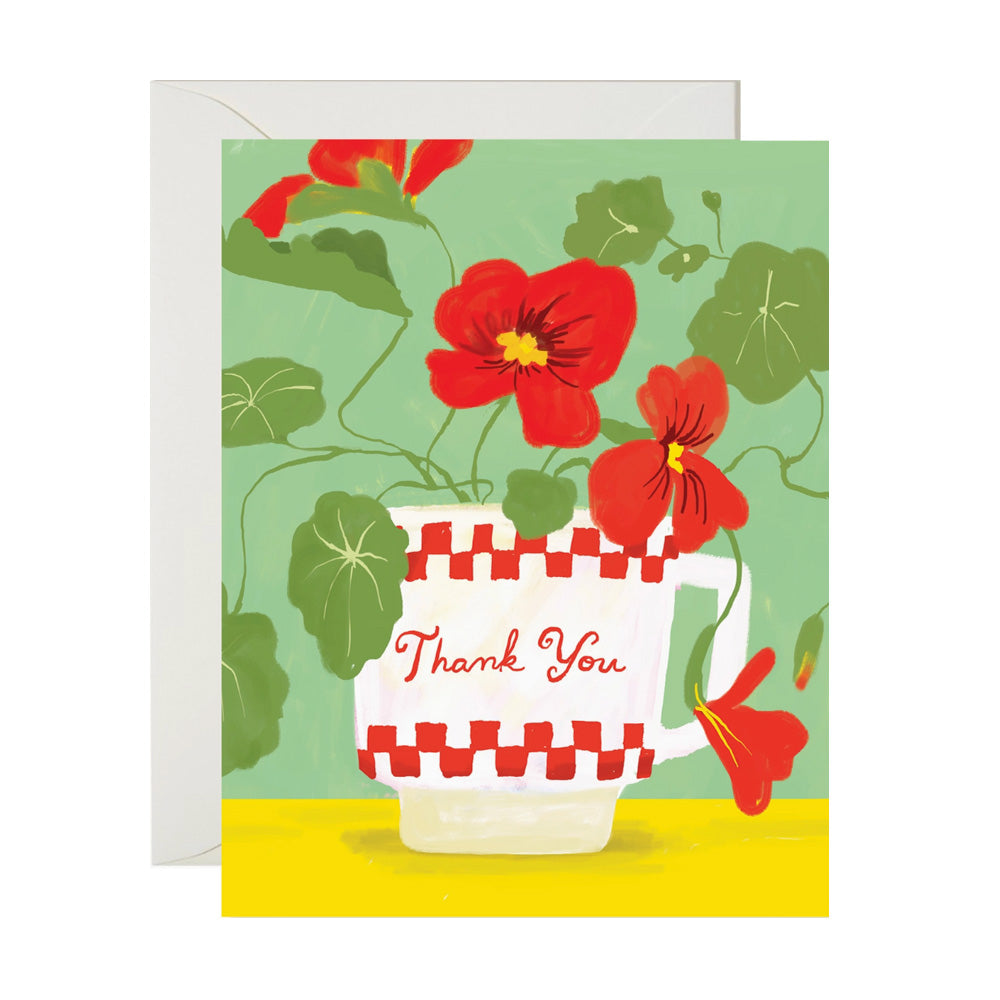 Greeting card with a diner mug and flowers  coming out of it on a green background. Mug says 'Thank You'
