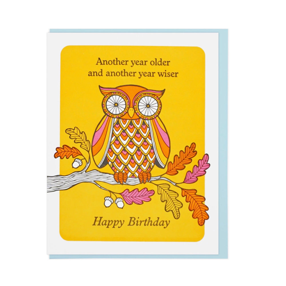 Birthday card with an owl illustration and text on a yellow background "Another year older and another year wiser, Happy Birthday"