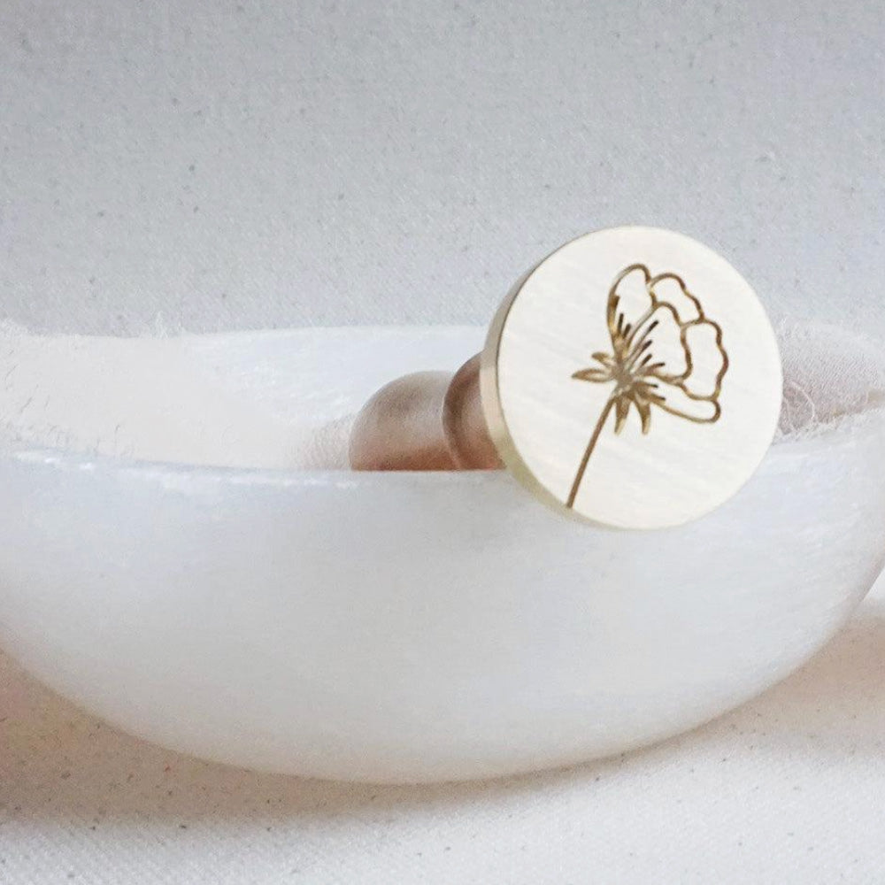 Gold wax seal head with peony outline on it
