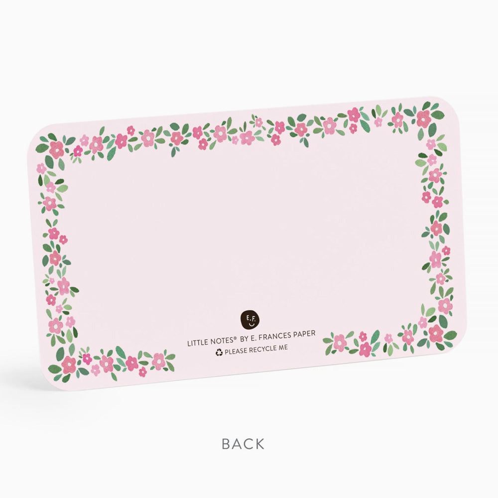 Floral border design on a pink background with branding text.