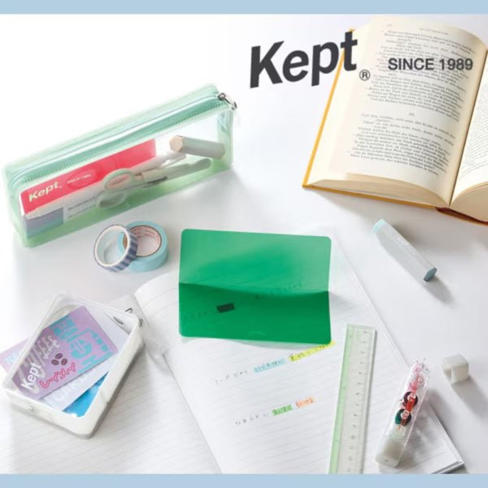 Kept branded stationery items including a notebook, pen, and other office supplies on a light background.