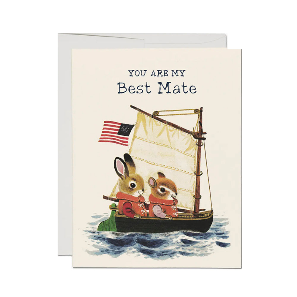 A cream color card with two small animals in an old-time ship on choppy waters with the words "You re My Best Mate on the top in a sailor font.