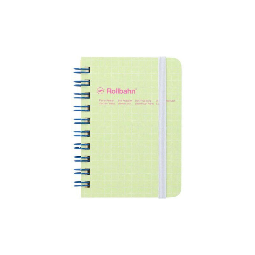 Light green notebook with blue spiral binding on a white background, featuring the brand 'Rollbahn'.