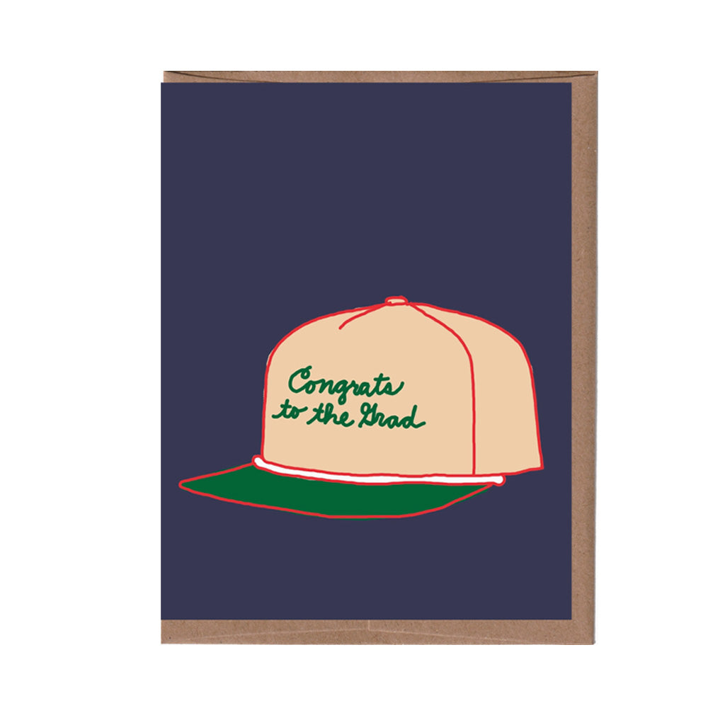 Greeting card with a cap design and 'Congrats to the Grad' text on a navy background