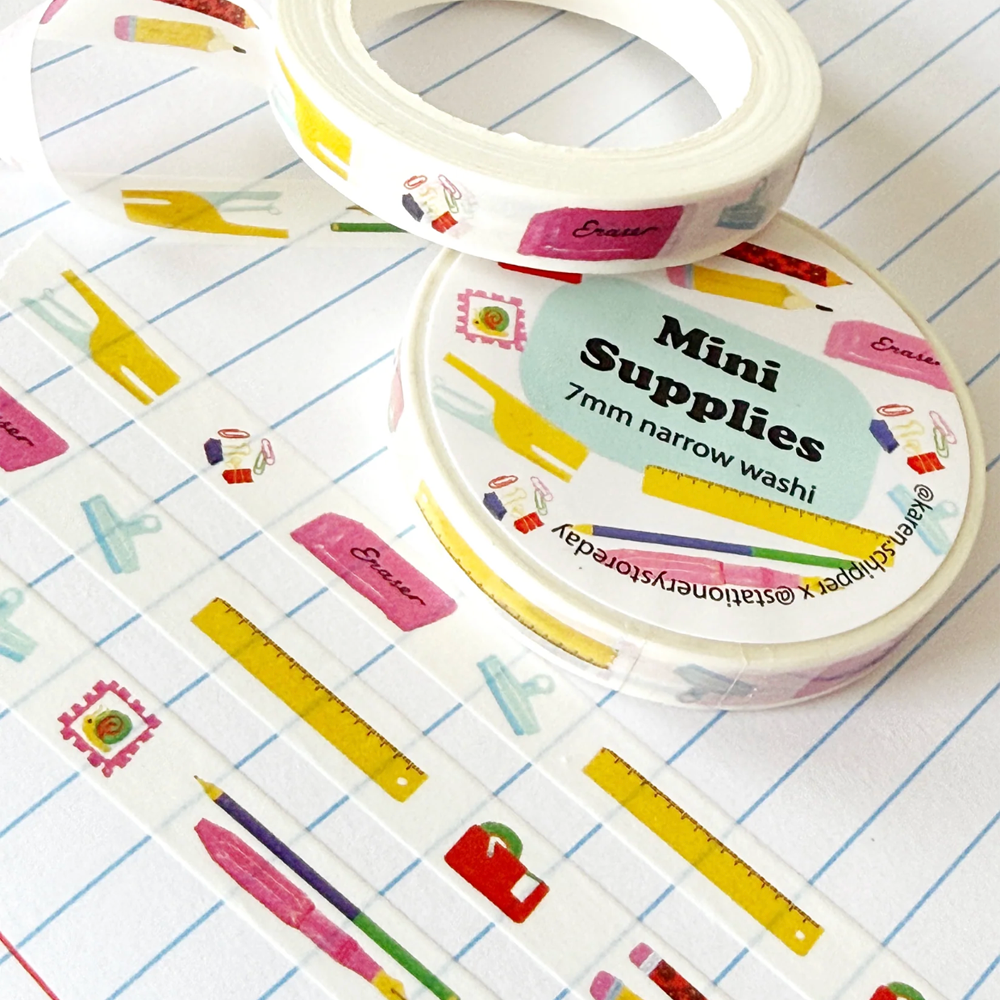 Washi tape with various stationery supplies like rulers, erasers, clips, and more.