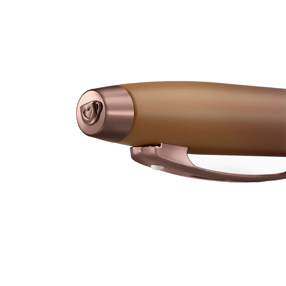 Close-up of a brown pen with rose gold accents on a white background